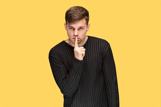 istock The young man pointing to something and looking at camera 691899504