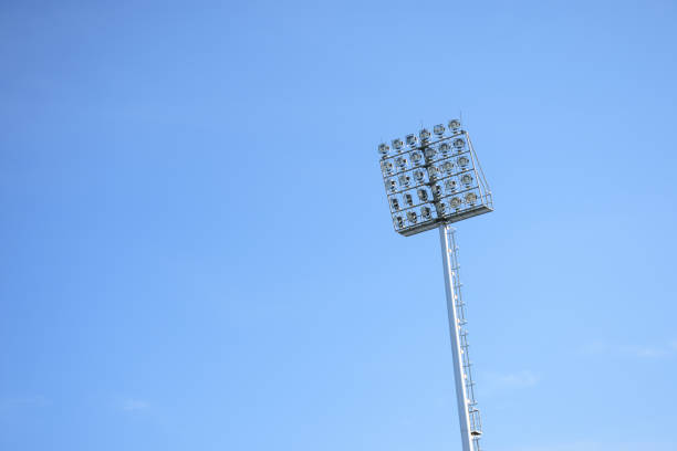 istock The stadium lighting isolated on blue sky 691905282
