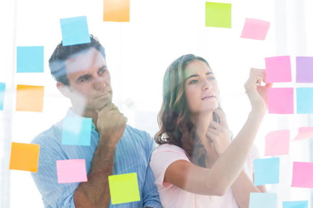 istock Young creative business people writing photo editor 691905522
