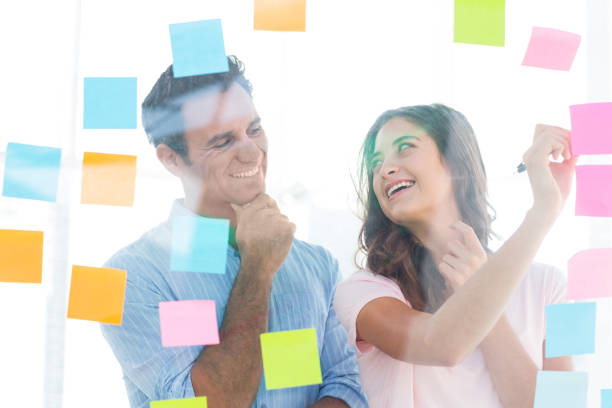 istock Young creative business people writing photo editor 691905600