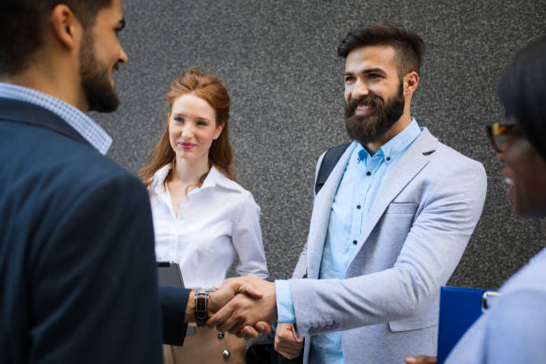 istock Two businessmen strengthening partnerships with a hand shake. 691905826