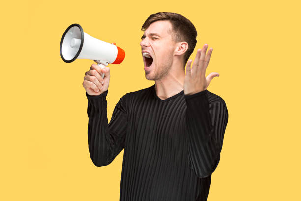 istock The young man holding a megaphone 691906018