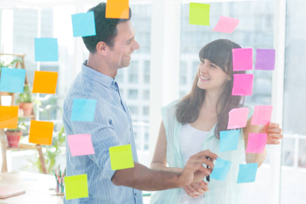 istock Young creative business people writing photo editor 691906030