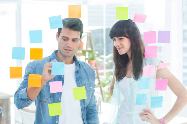 istock Young creative business people writing photo editor 691906252