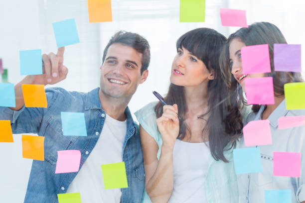 istock Young creative business people looking at photo editor 691908742