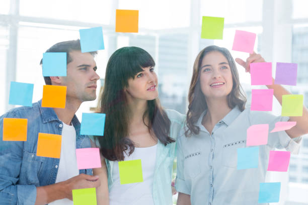istock Young creative business people looking at photo editor 691908808