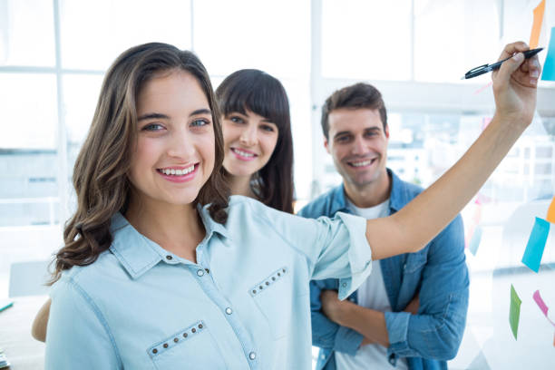 istock Young creative business people writing photo editor 691909140