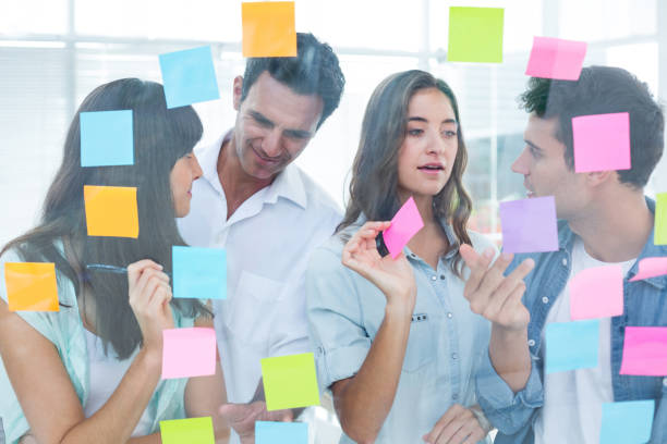 istock Young creative business people writing photo editor 691909594