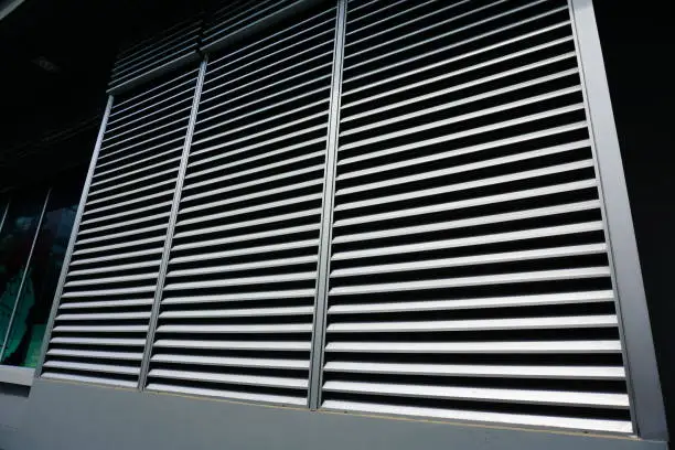 Photo of Opened metallic window shutter at the office building