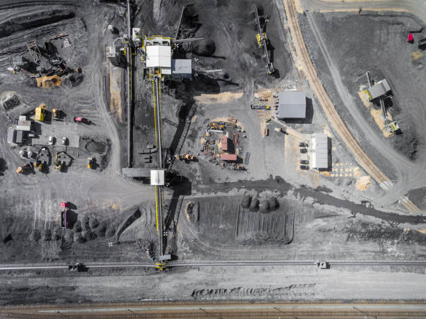 Black coal deposits. Exploration and machine. View from above.