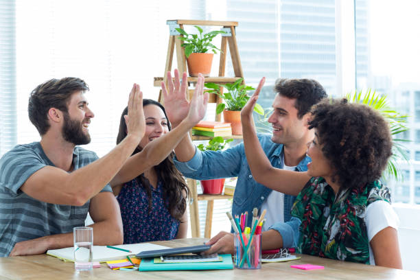 istock Creative business team putting their hands together 691920902