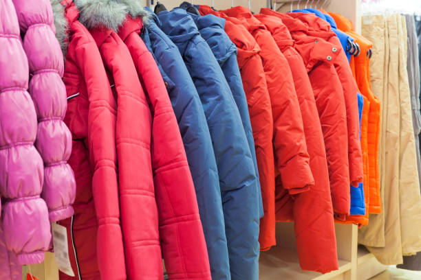 istock Winter clothes hanging at a store 691927768