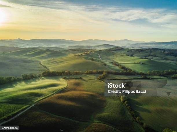 Tuscany Landscape At Sunrise With Low Fog Stock Photo - Download Image Now - Landscape - Scenery, Scenics - Nature, Nature