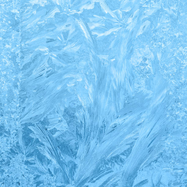 istock beautiful winter ice, blue texture on window, festive background, close up 691933672