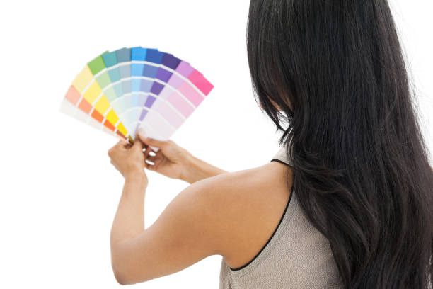 istock Rear view of a woman looking at paint samples 691934080
