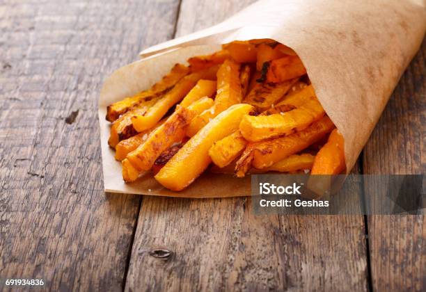 Baked Butternut Squash Fries With Sea Salt Pumpkin Chips Stock Photo - Download Image Now