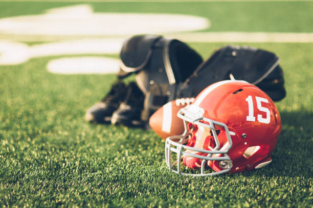 istock Red Football Helmet on Field 691943586