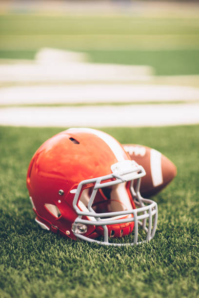 istock Red Football Helmet on Field 691943614