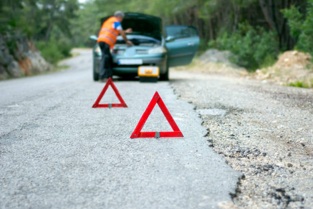 istock Repairman near broken down car 691949758