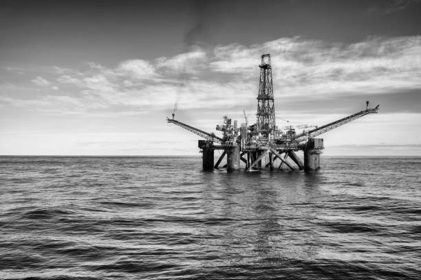 Black and white photo of an offshore oil installation stock photo