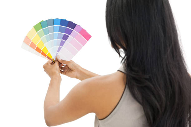 istock Rear view of a woman looking at paint samples 691959900