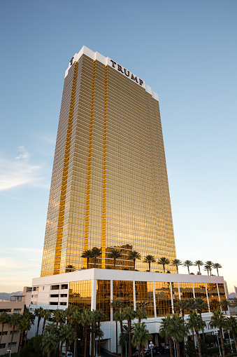 Las Vegas, USA - October 26, 2016:  Trump International Hotel in Las Vegas, NV seen in evening light.  Named for US real estate developer and politician Donald Trump, the 64-story luxury property's exterior windows are gilded with 24-carat gold.