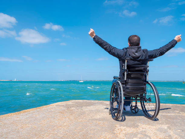 istock Disabled young man sitting in a wheelchair 691966648