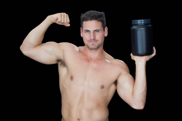 istock Happy muscular man posing with nutritional supplement 691972256