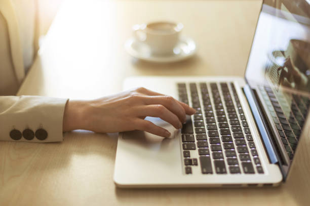 istock Place of work. Hands on laptop keyboard 691978174