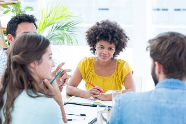 istock Cheerful creative business team in meeting 691981810