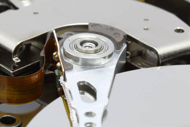 istock Mechanism of actuator arm inside HDD 691981812