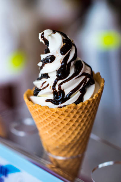 istock Preparation of ice cream in a waffle cup 691987646
