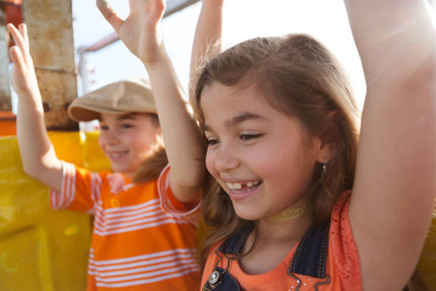 istock Two Children Ride a Ferris Wheel 691987868