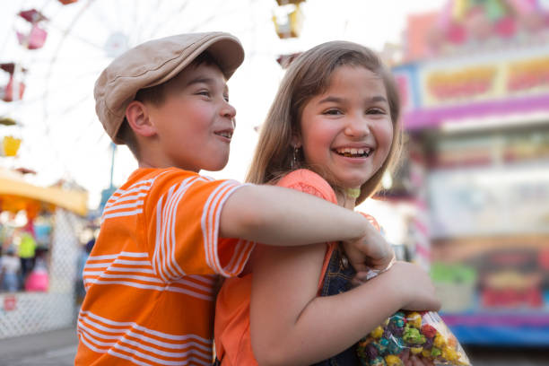 istock Boy and Girl Sharing Snack at a Carnival 691988550