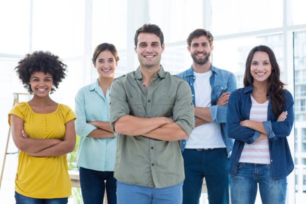 istock Group portrait of happy young colleagues 691988628