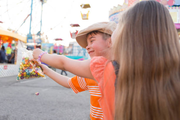 istock Boy and Girl Sharing Snack at a Carnival 691988738