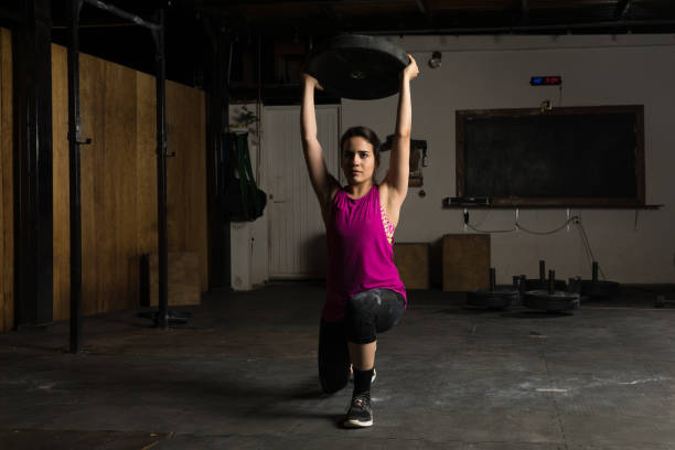 istock Hispanic woman working out at a gym 692024178
