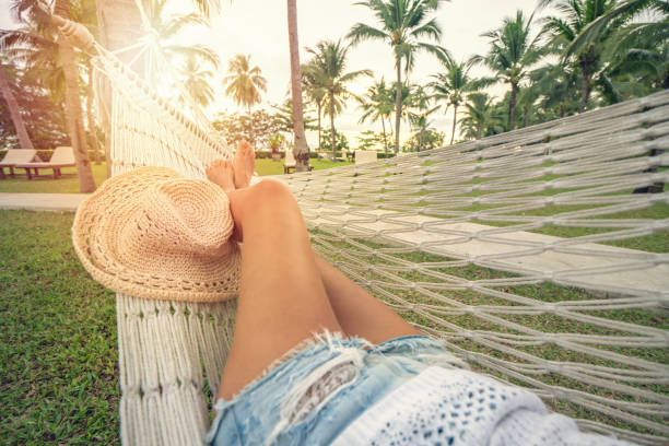 istock Woman resting on hammock, Thailand 692026784