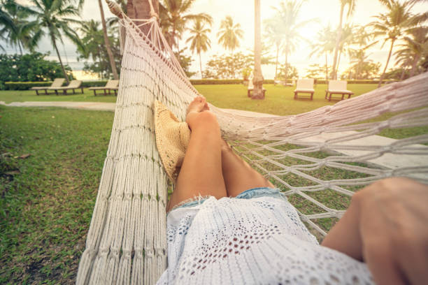 istock Woman resting on hammock, Thailand 692034346