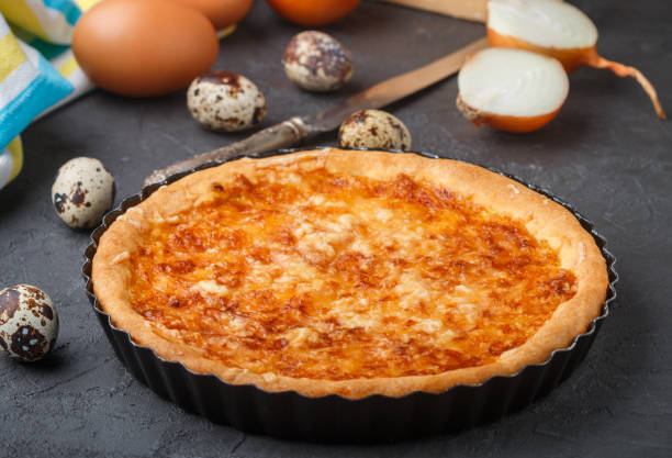 istock Homemade gourmet pie with cheese, onions and eggs. Selective focus 692052216