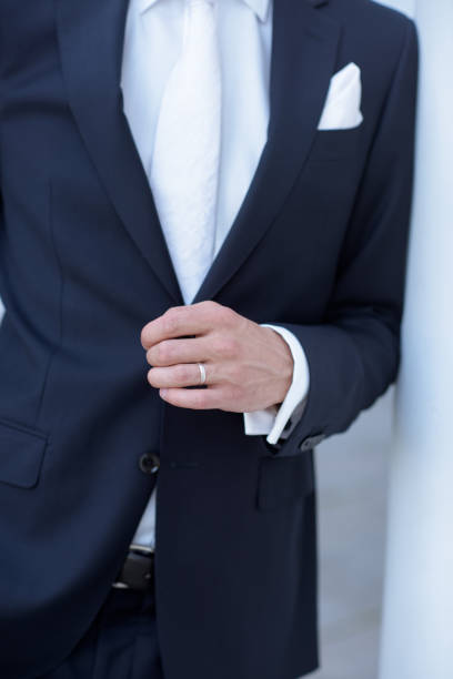 istock Handsome groom in suit in the nature 692052670
