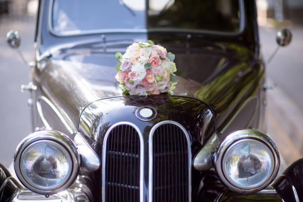 istock Beautiful wedding colorful bouquet and car for bride 692052876