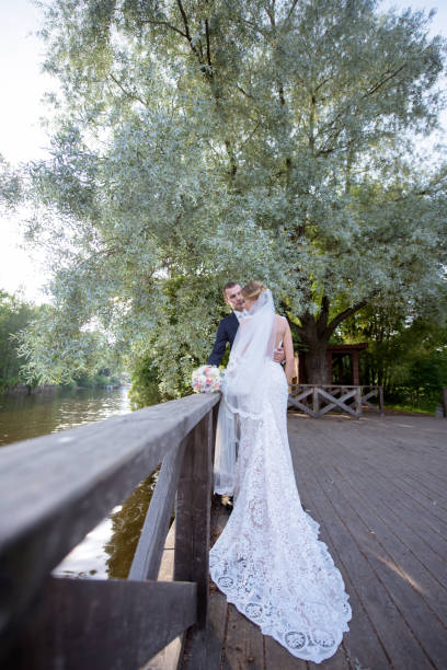 istock Wedding couple on the nature is hugging each other 692056360
