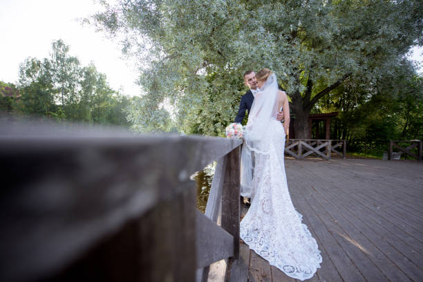 istock Wedding couple on the nature is hugging each other 692056382