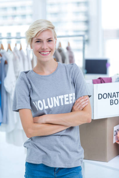 istock Female volunteer with arms crossed 692057252