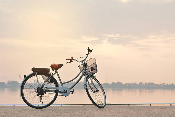 istock Bicycle By Sea Against Sky During Sunset 692061037