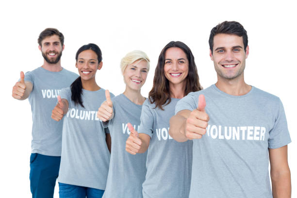 istock Happy volunteers friends gesturing thumbs up 692064046