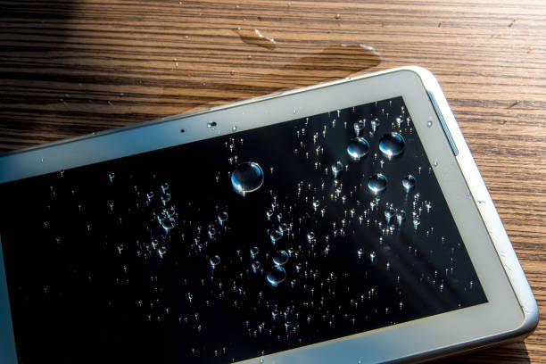 istock Water spilled onto the tablet 692064198