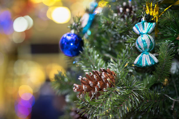 istock Decorations on christmas tree at night with bokeh on background, soft focus 692067598