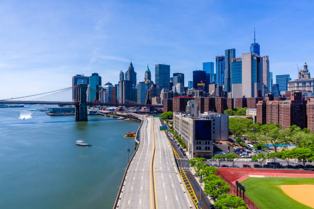 istock Manhattan and the Brooklyn Bridge in a sunny day 692067968